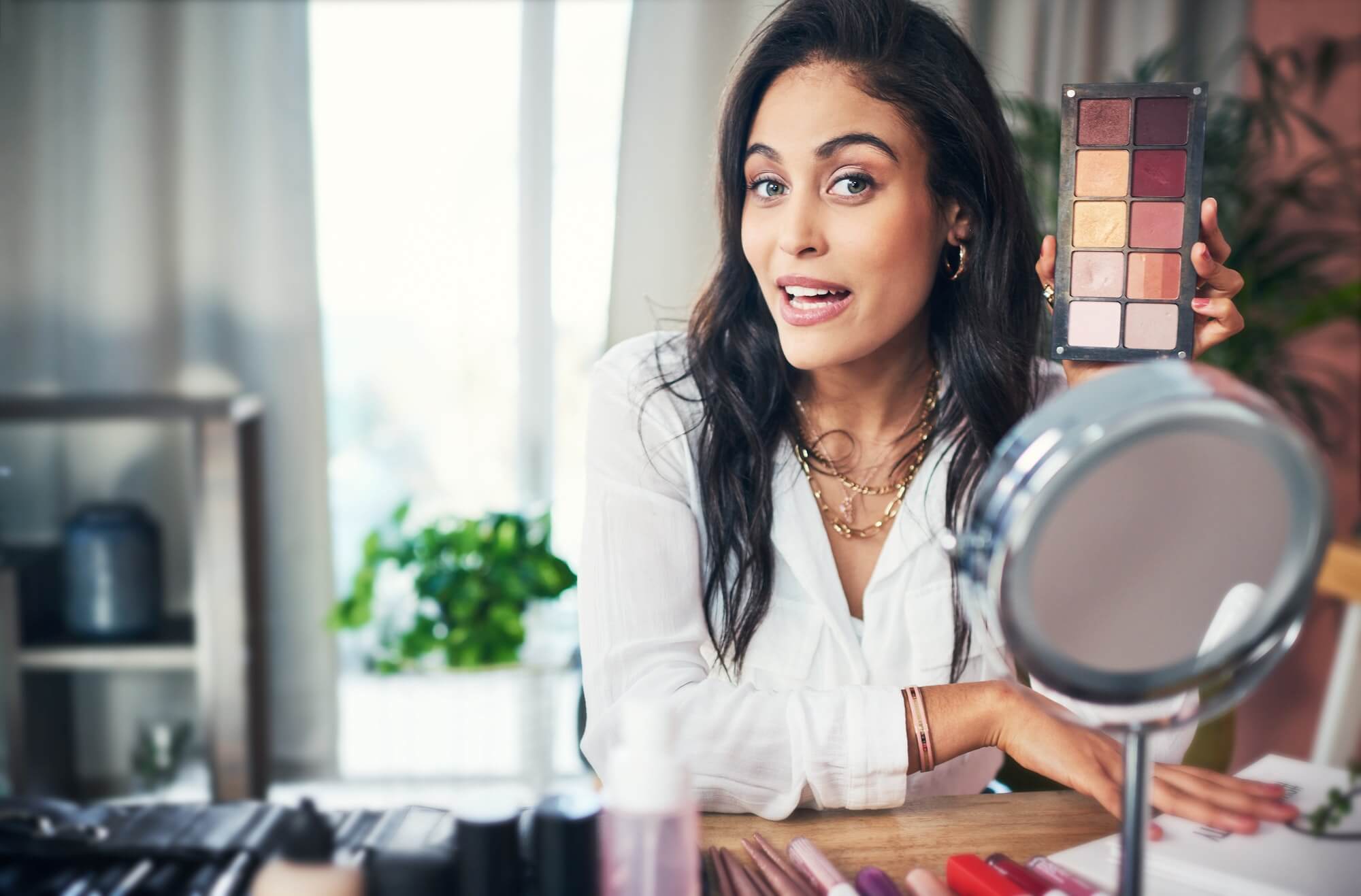 shot-of-a-influencer-recording-a-makeup-tutorial-for-her-blog-at-home-1.jpg